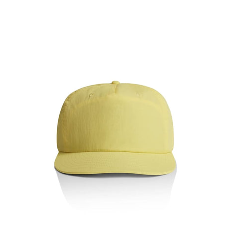 A yellow cap with a flat brim and a logo on the front, featuring ventilation holes on the top.